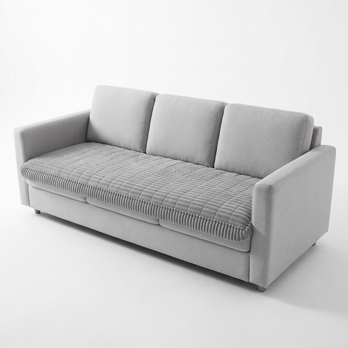 Grey plush couch cover on a sofa